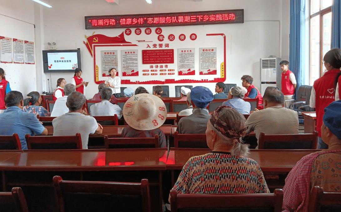 图为志愿者宣传禁毒防艾相关知识.png 图为志愿者宣传禁毒防艾相关知识.png